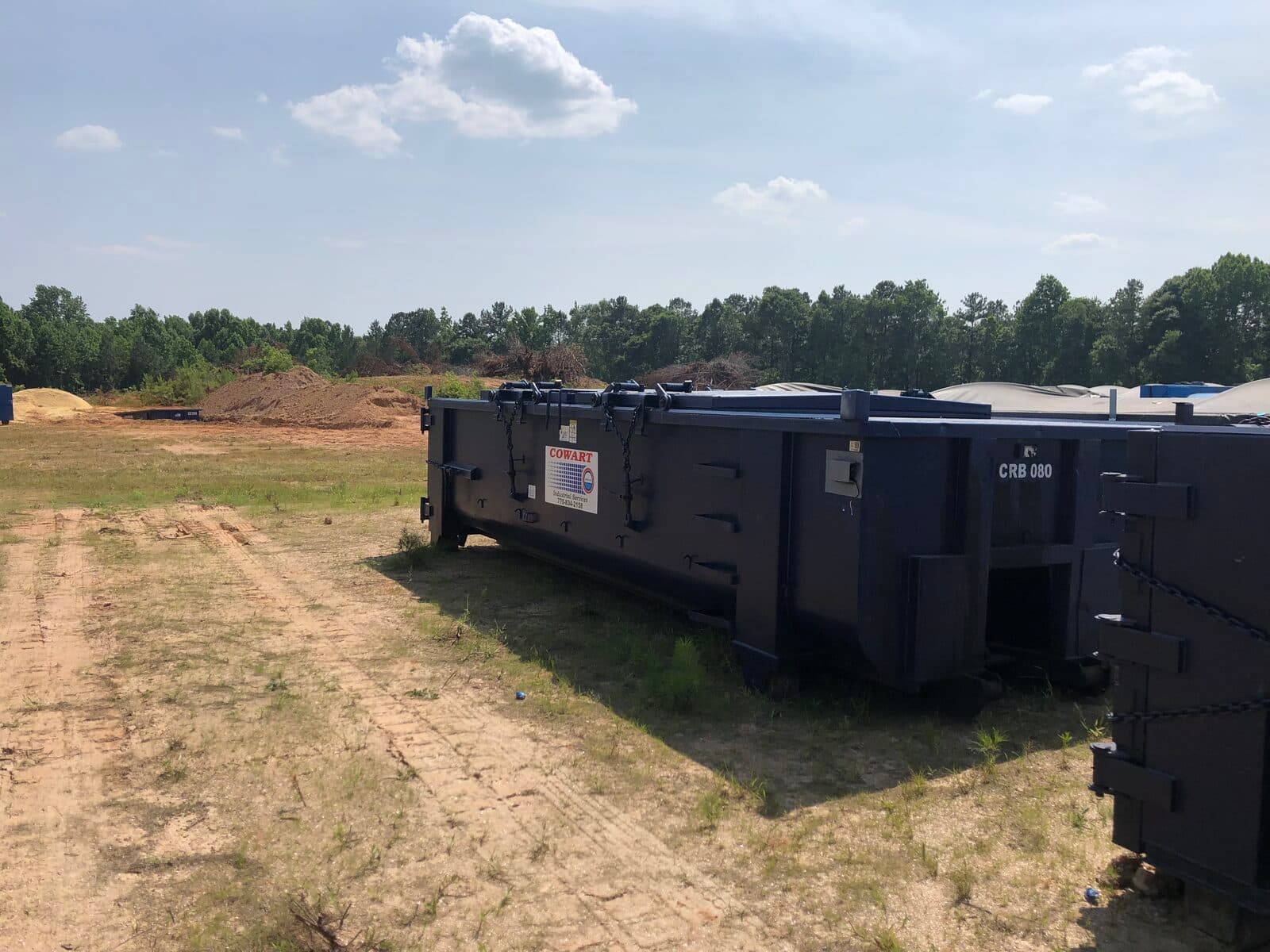 Cowart roll-off box CRB-080 staged at a jobsite
