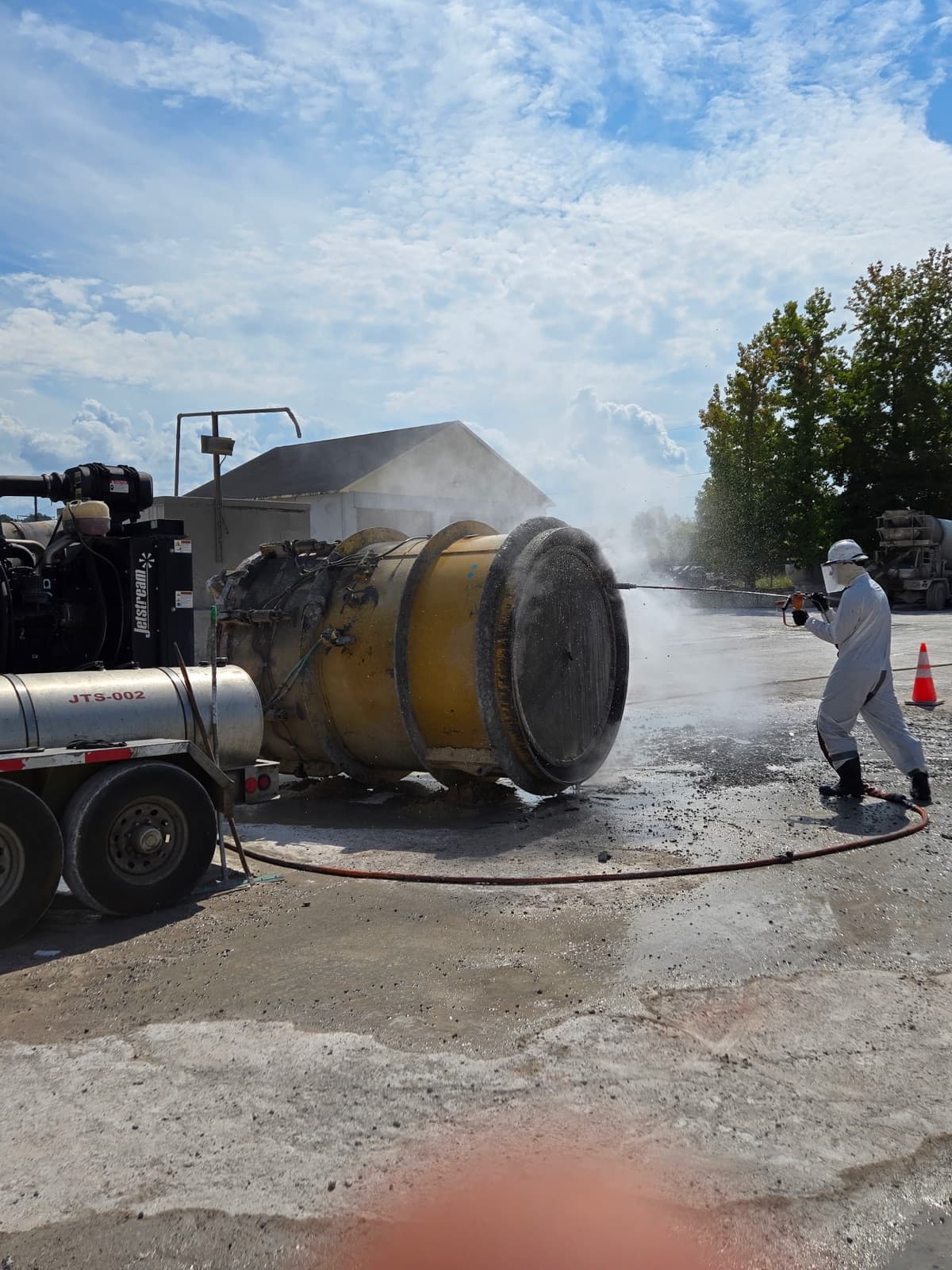 Cowart hydroblasting operator cleaning an industrial tank at 40,000 PSI