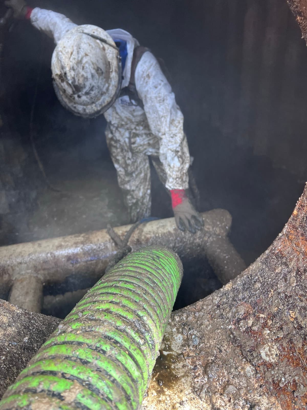 Cowart technician pumping in a confined-space manhole